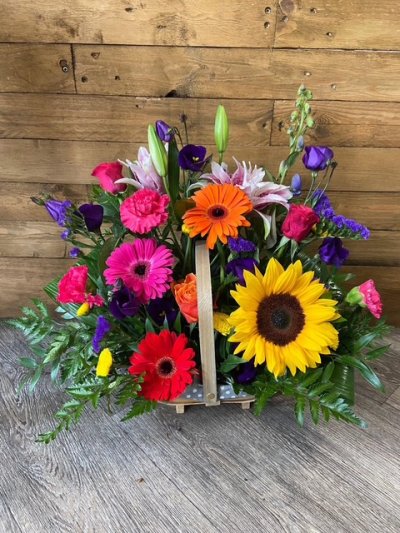 Bright Basket Arrangement - A beautiful basket arrangement of vibrant and colourful flowers. Exact basket and flower used may vary depending on availability. The size shown in picture is standard.
