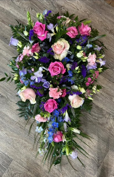 Pink & Purple Single Ended Spray - This would be a single ended spray with a mix of pink and purple flowers. Exact flowers may vary depending on availability but we will always try and keep as close to the picture as possible.